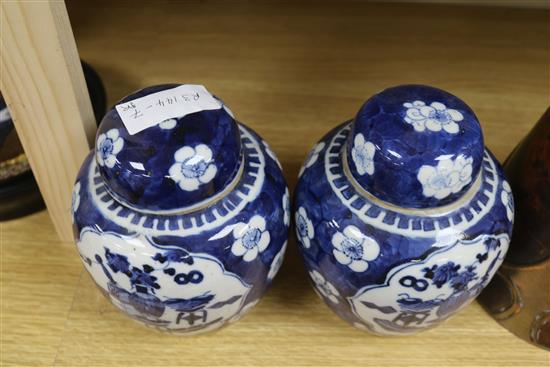 A pair of Chinese blue and white jars and covers